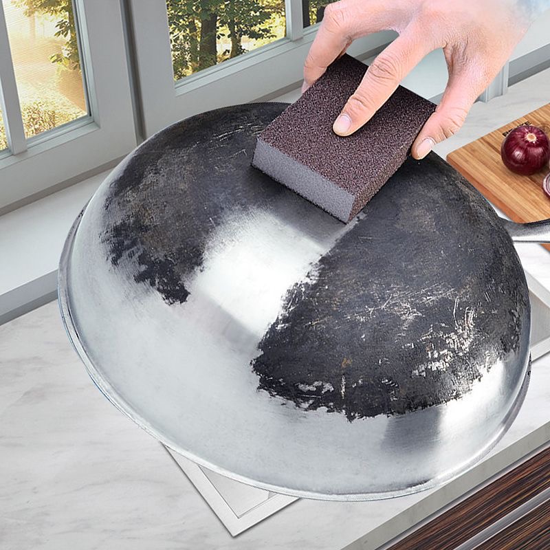 Abrasive sponge to wipe the bottom of the pan